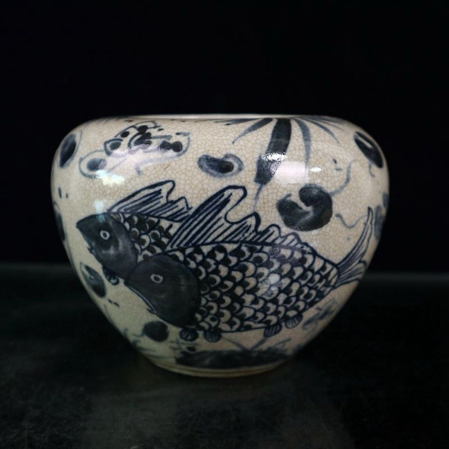 Open blue and white fish and algae patterned jar