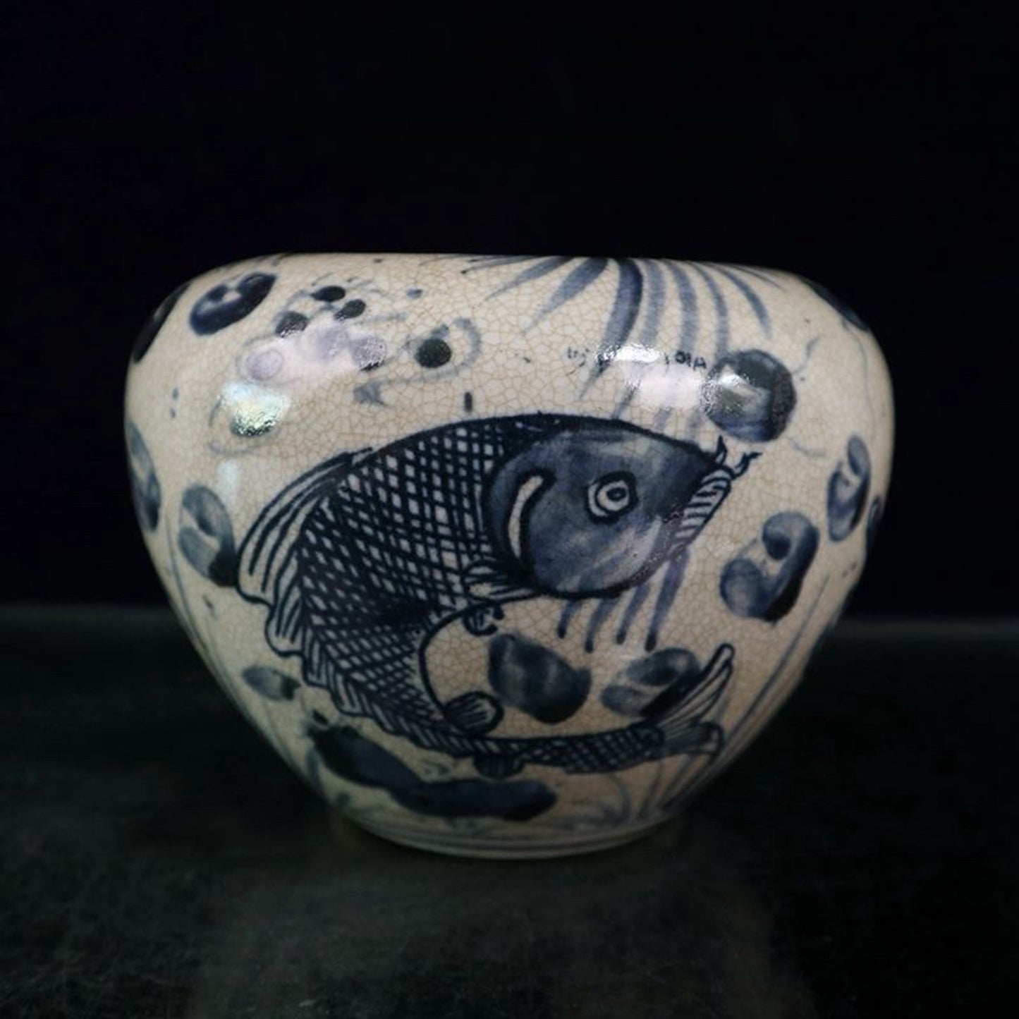 Open blue and white fish and algae patterned jar