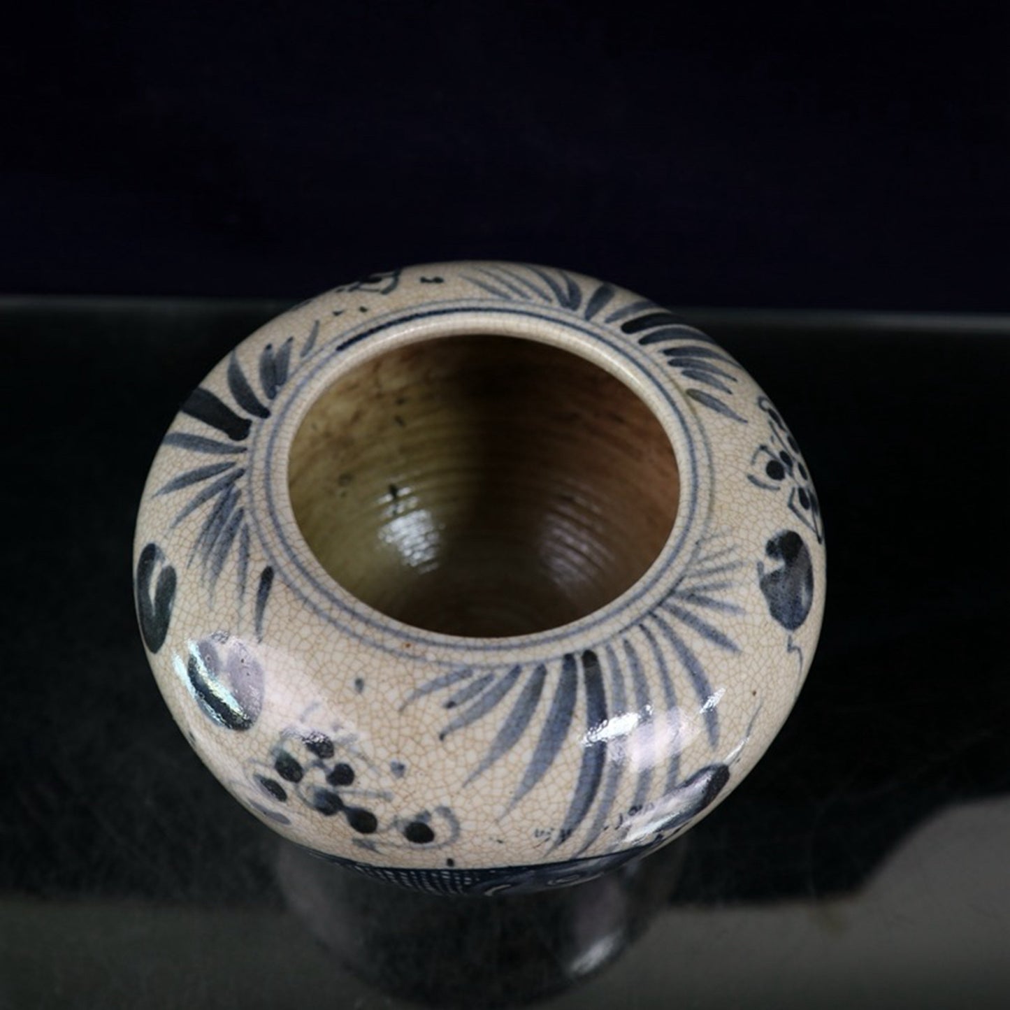 Open blue and white fish and algae patterned jar