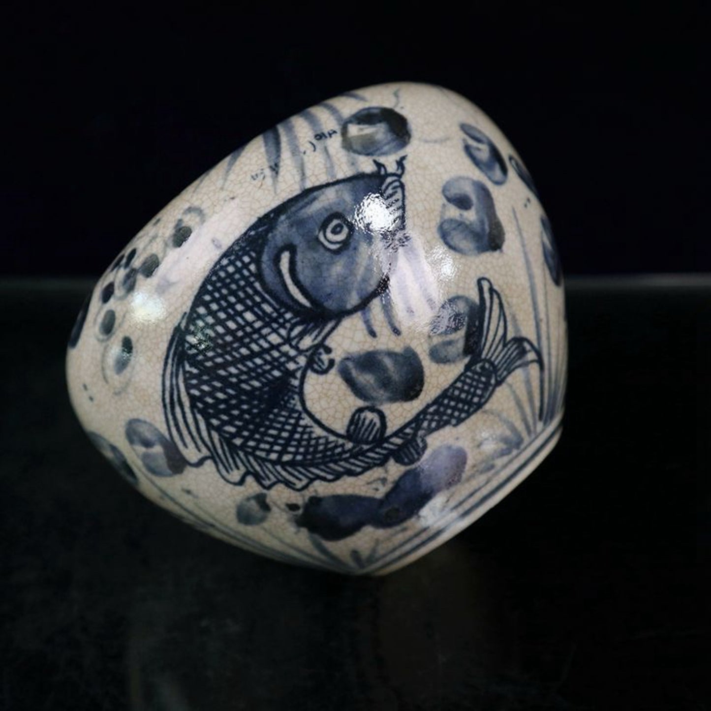Open blue and white fish and algae patterned jar