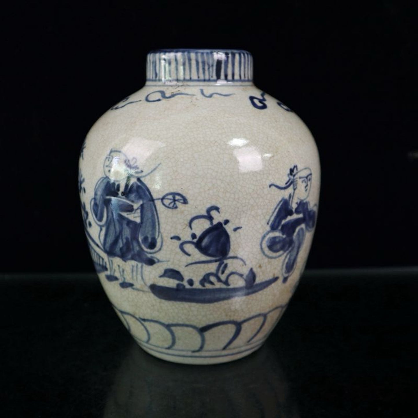 Open blue and white figure patterned jar
