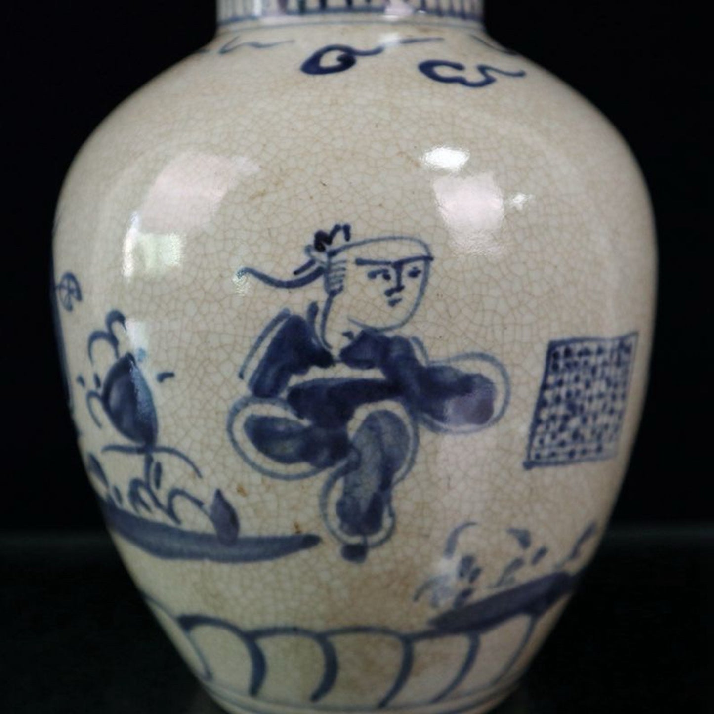 Open blue and white figure patterned jar