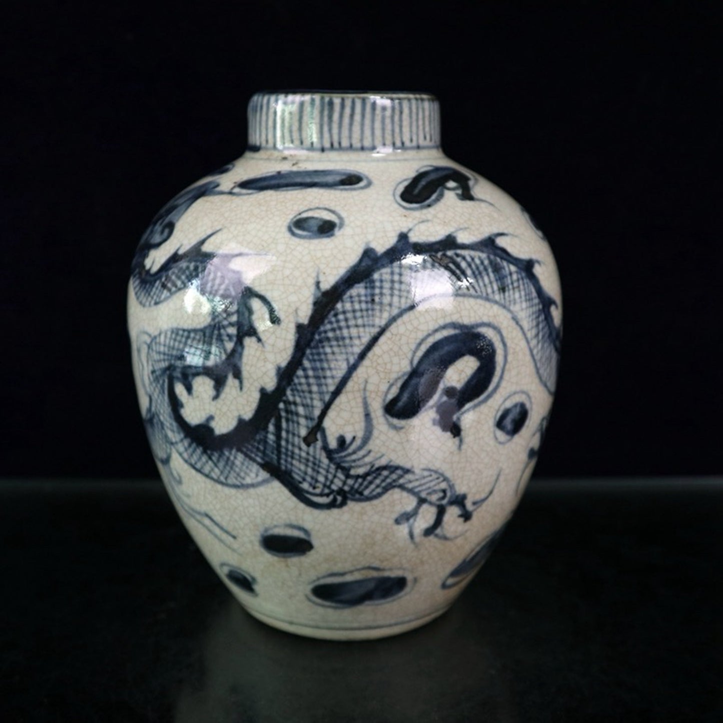 Open blue and white dragon patterned jar