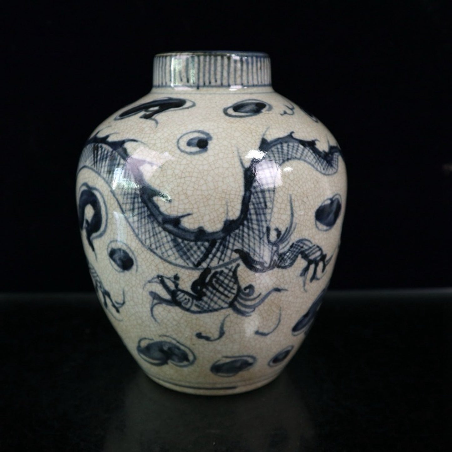 Open blue and white dragon patterned jar