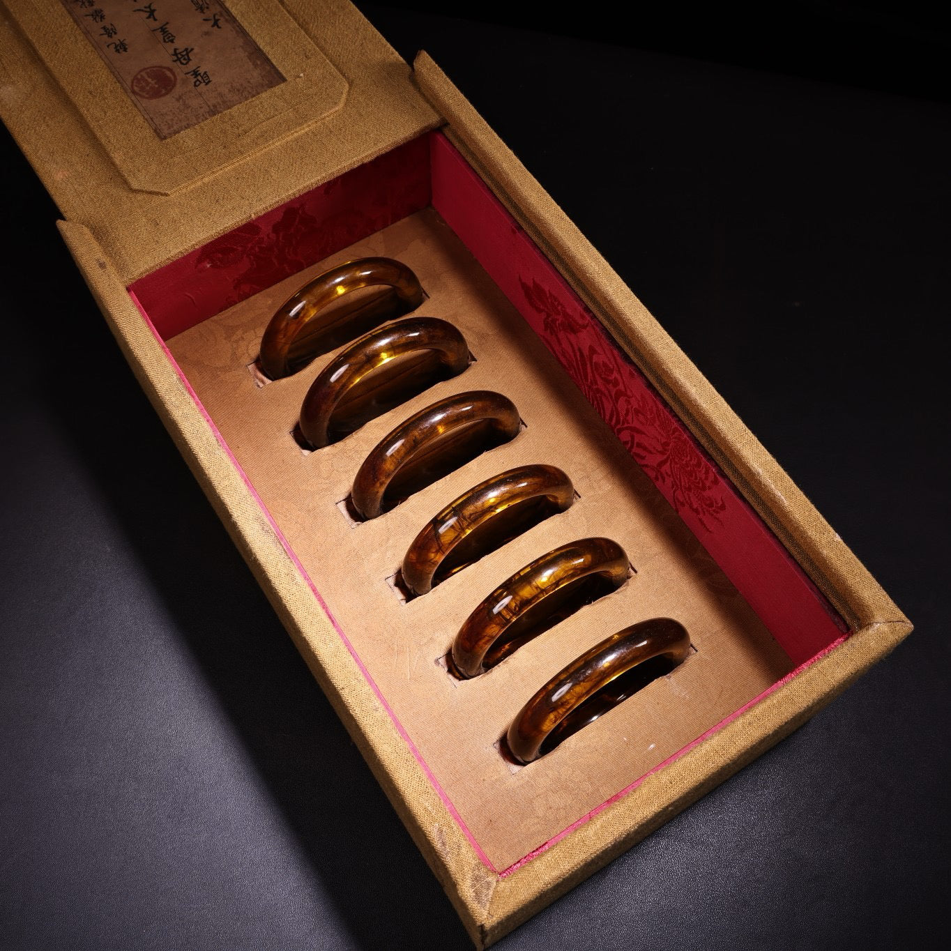 A box of Chinese antique amber bracelets