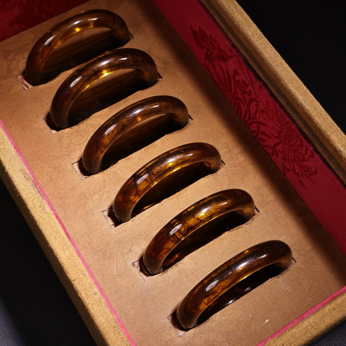 A box of Chinese antique amber bracelets