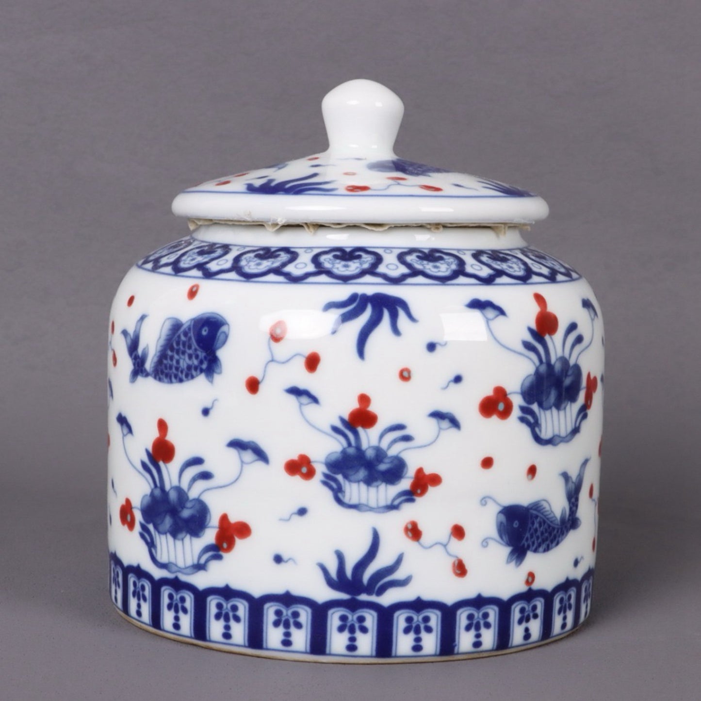Blue and white glazed red fish algae patterned tea jar