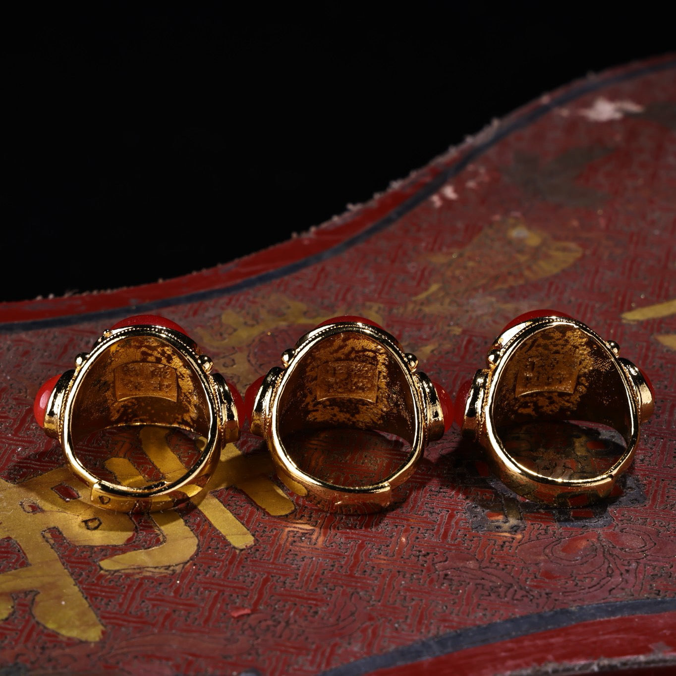 A box of Chinese antique red cat's eye stone rings