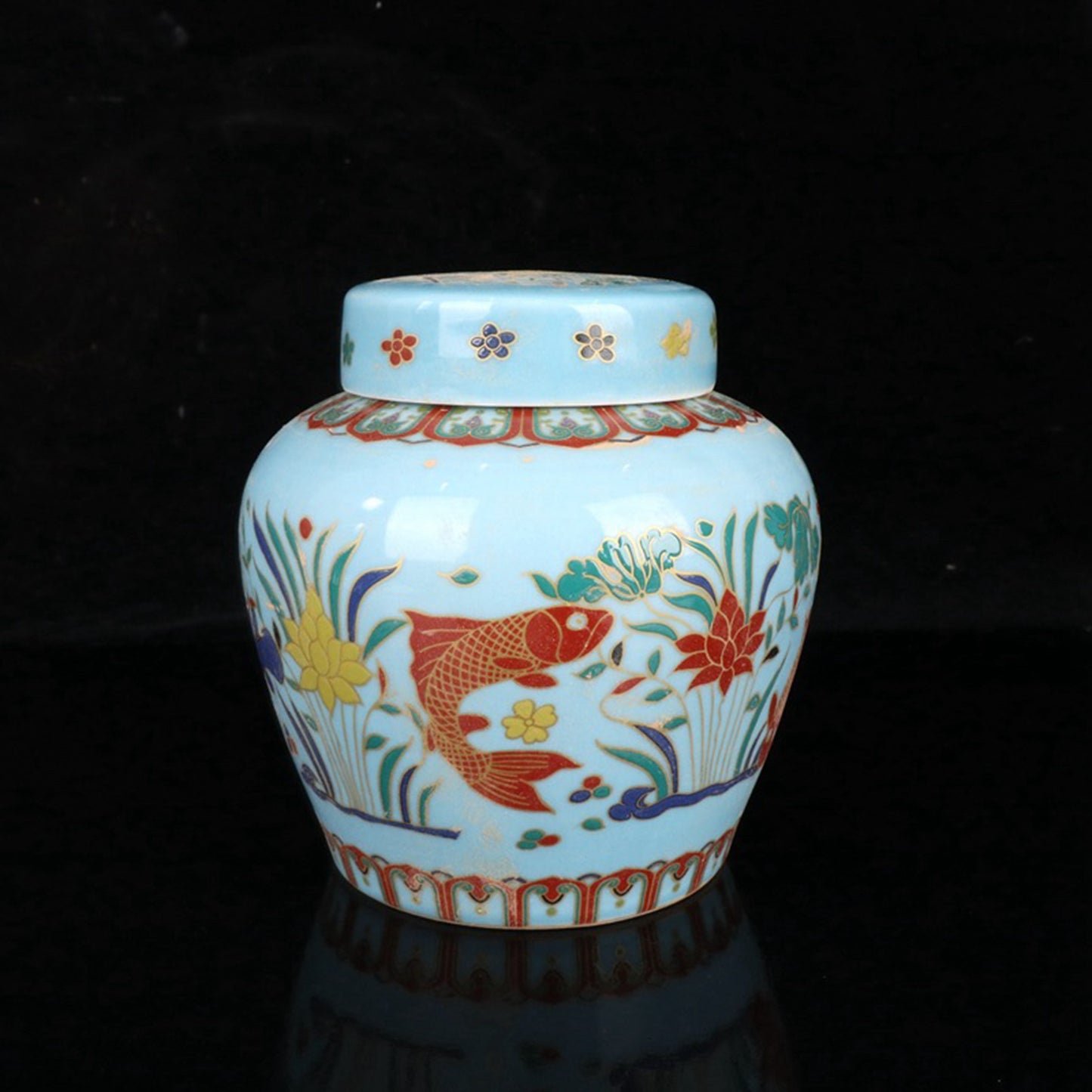Colored fish and algae patterned sky shaped jar