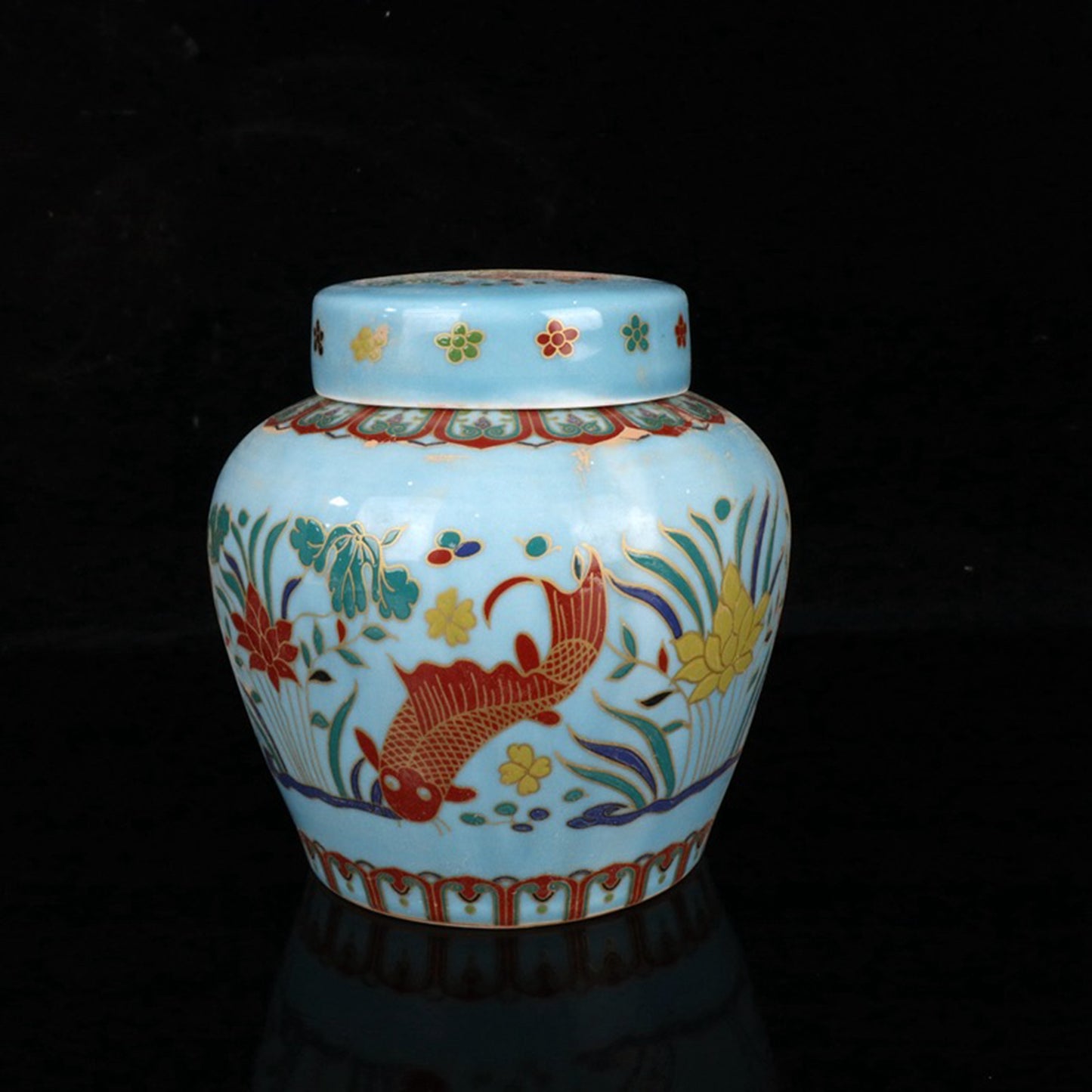 Colored fish and algae patterned sky shaped jar