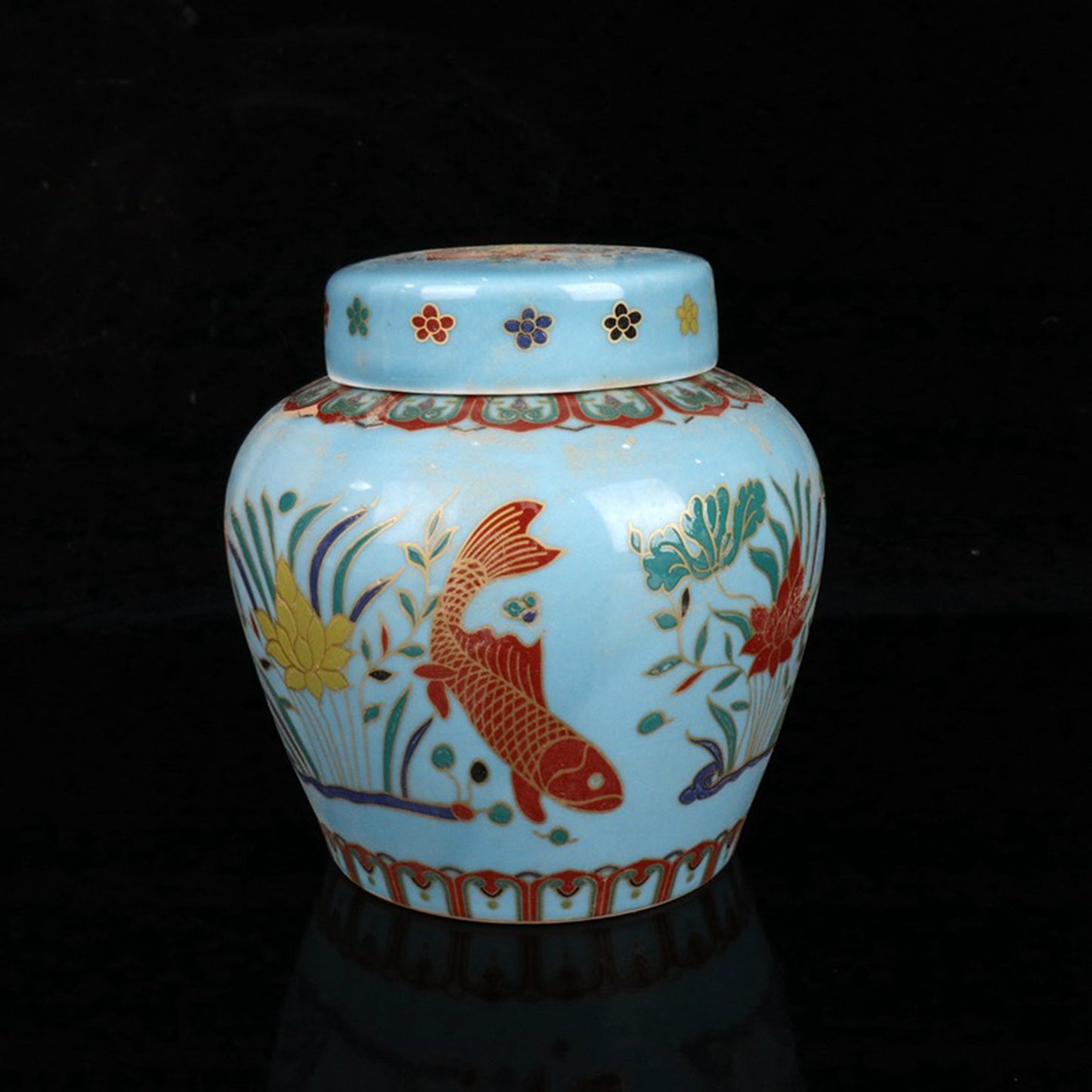 Colored fish and algae patterned sky shaped jar