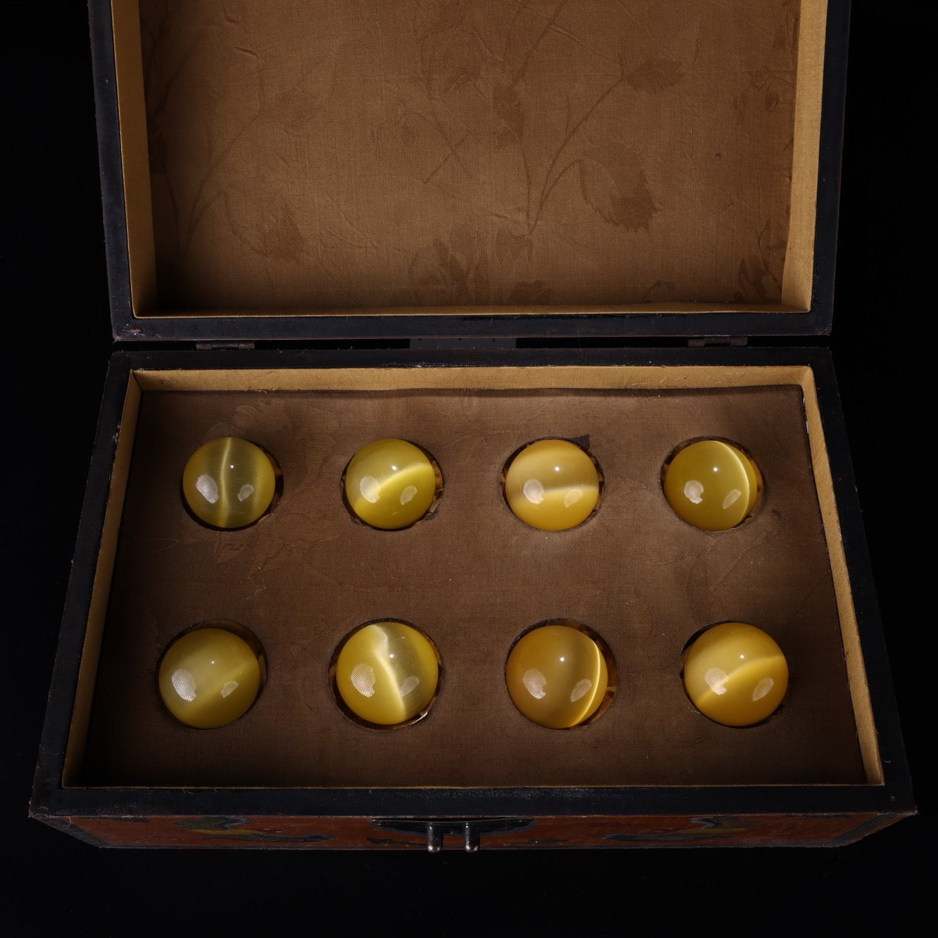 A box of Chinese antique yellow cat eyeballs