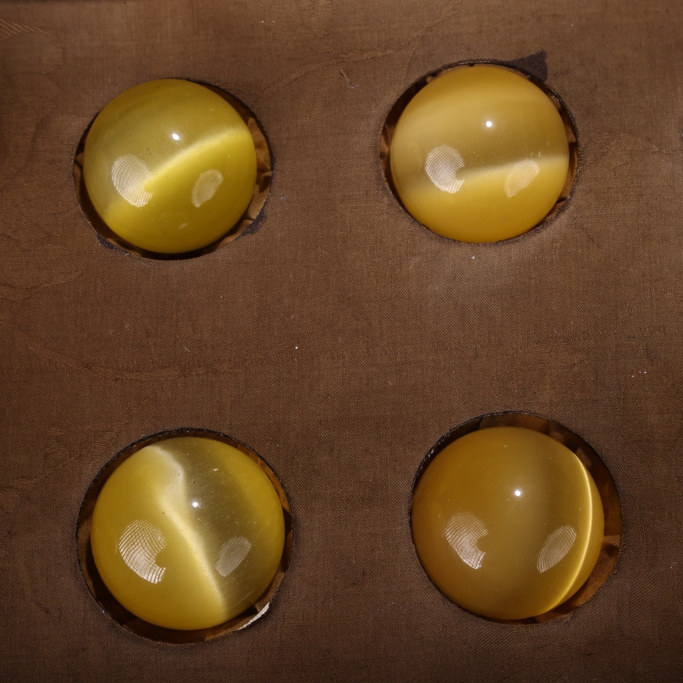 A box of Chinese antique yellow cat eyeballs