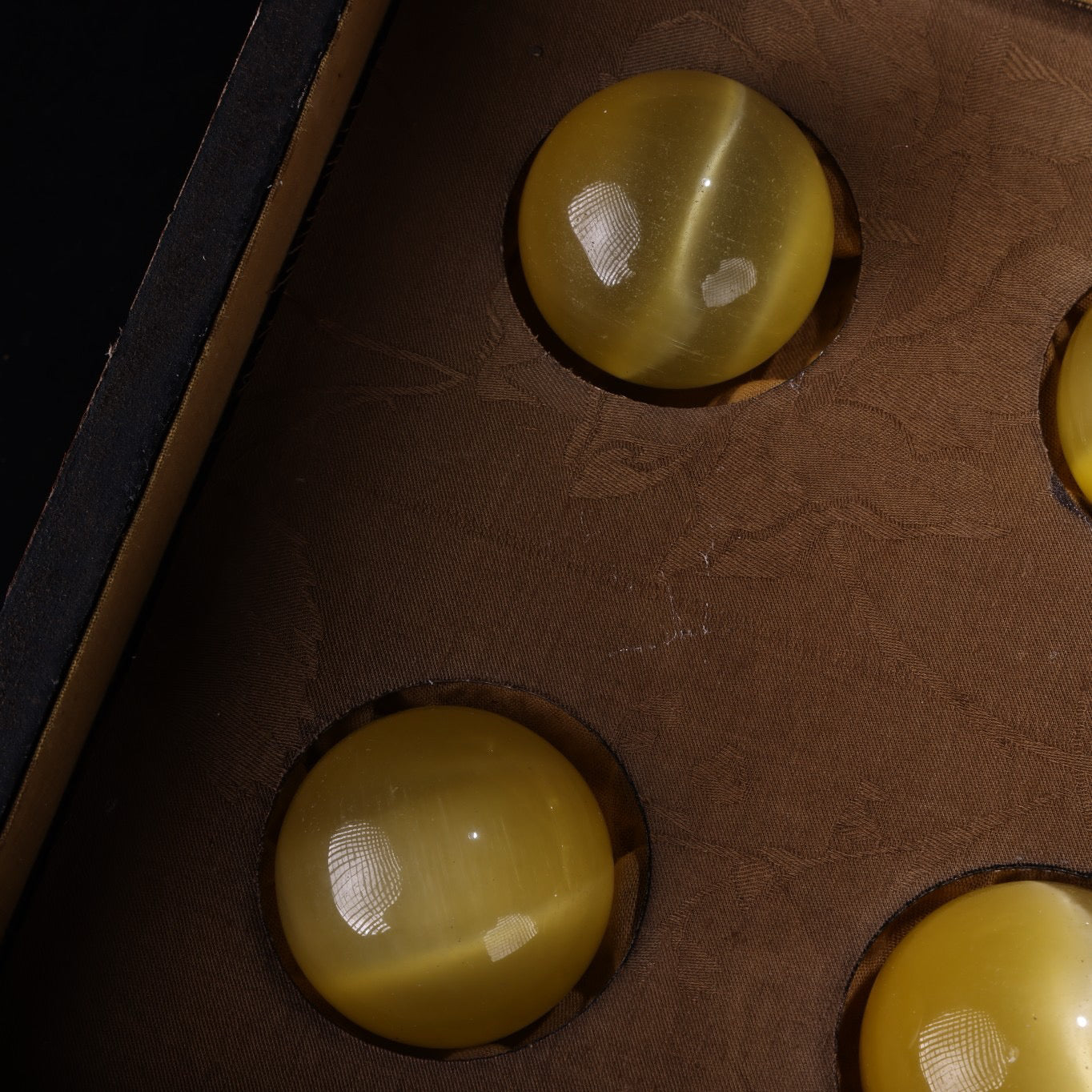 A box of Chinese antique yellow cat eyeballs