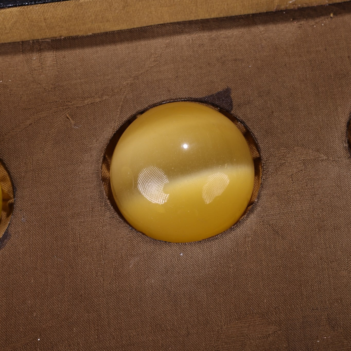 A box of Chinese antique yellow cat eyeballs