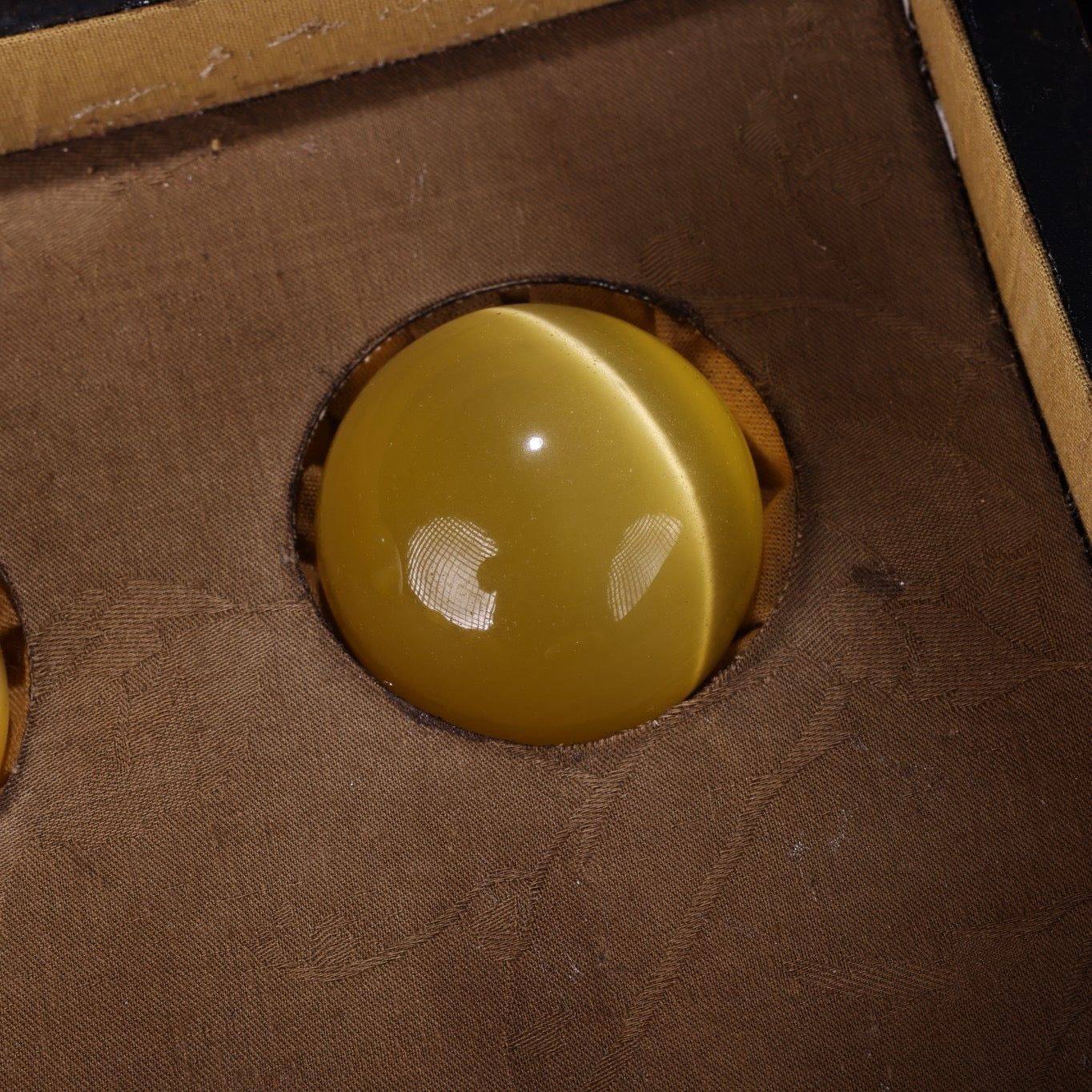 A box of Chinese antique yellow cat eyeballs