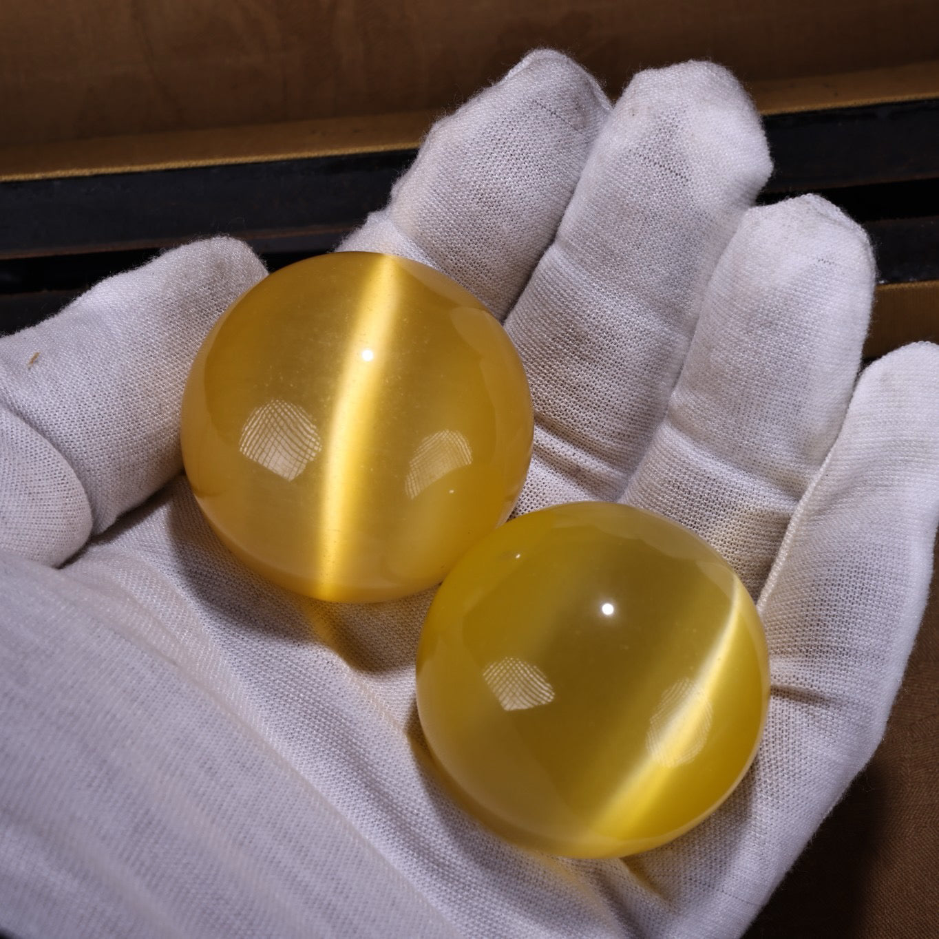 A box of Chinese antique yellow cat eyeballs