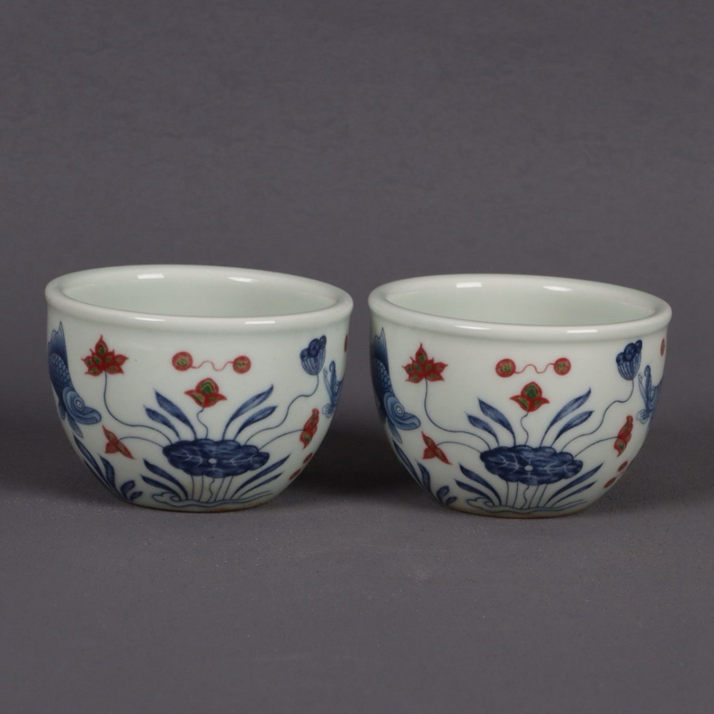 Blue and white glazed red fish and algae patterned small mouth cup