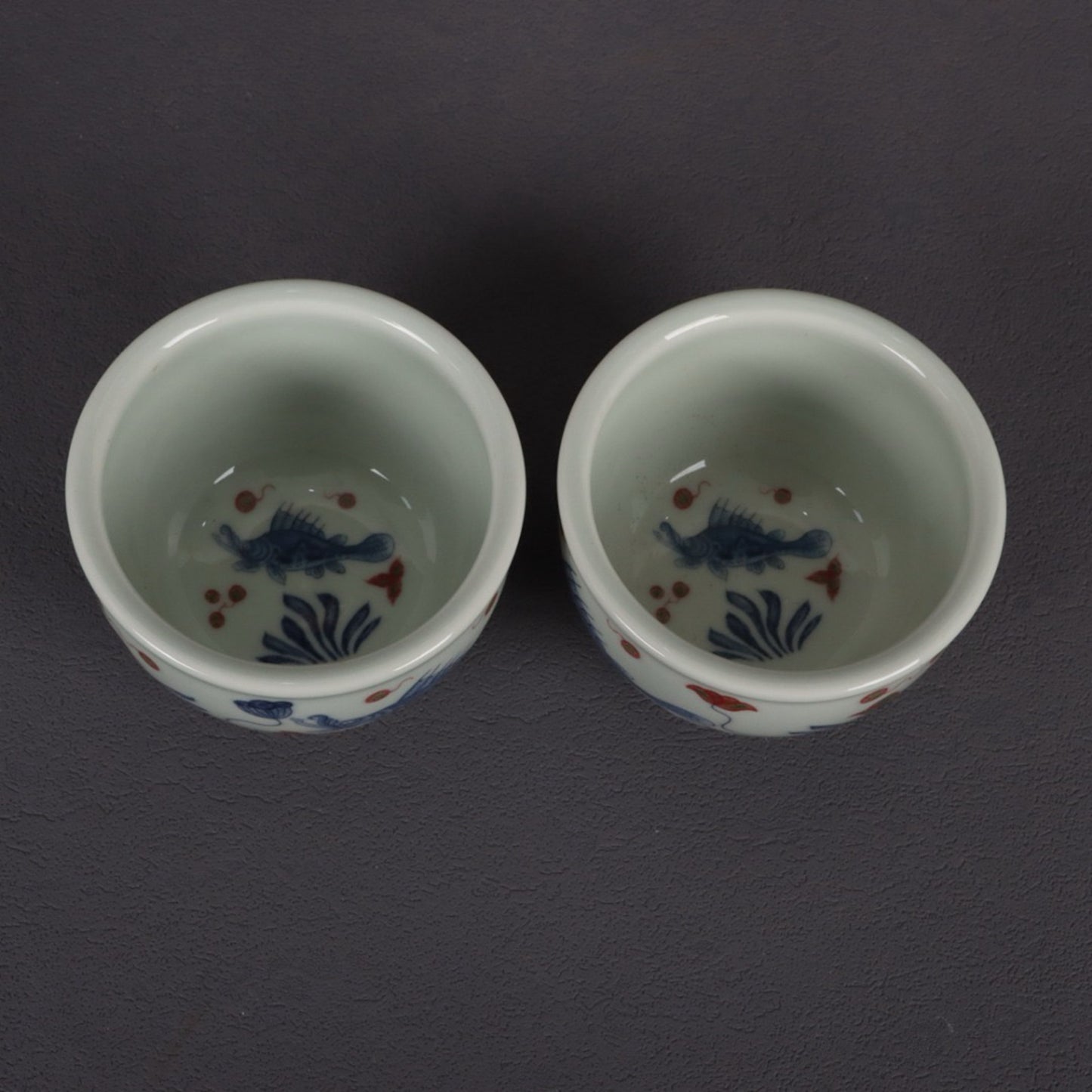 Blue and white glazed red fish and algae patterned small mouth cup