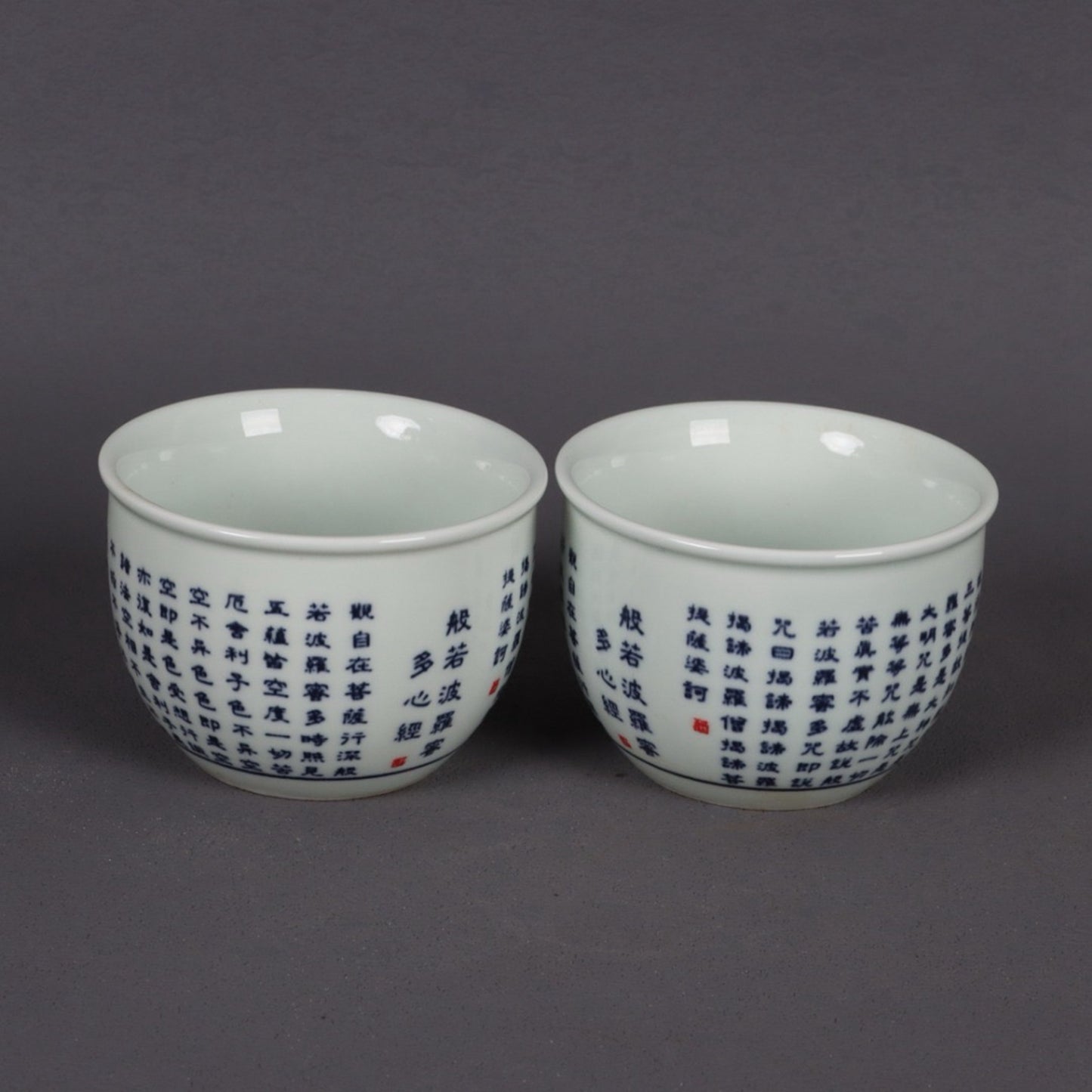 A pair of blue and white Polomi Heart Sutra patterned mouth cups