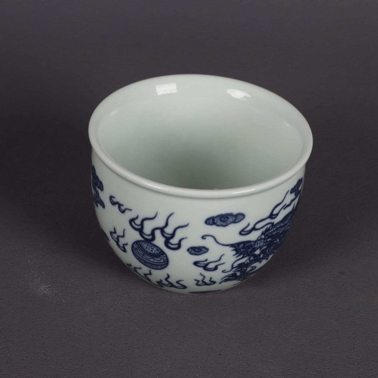 A pair of blue and white dragon patterned cups