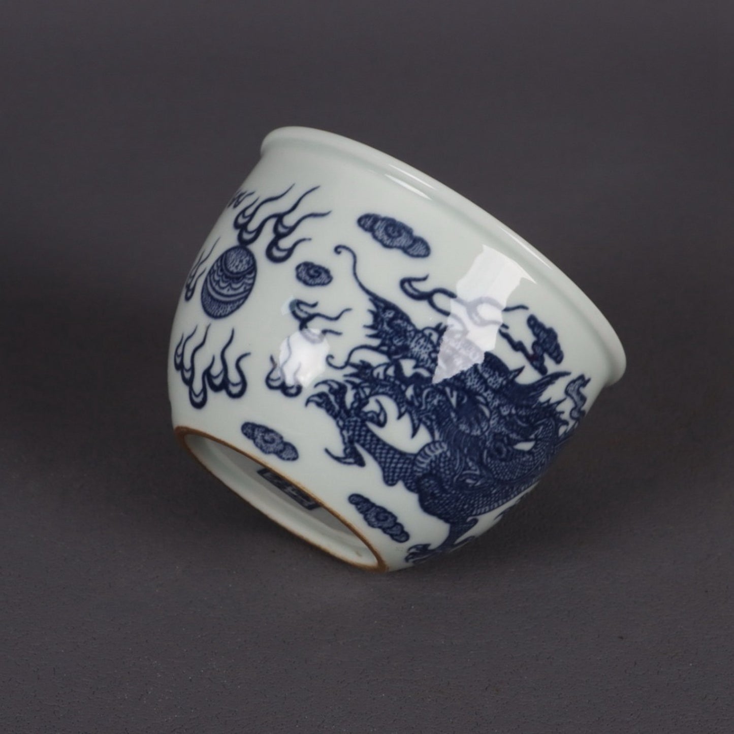 A pair of blue and white dragon patterned cups