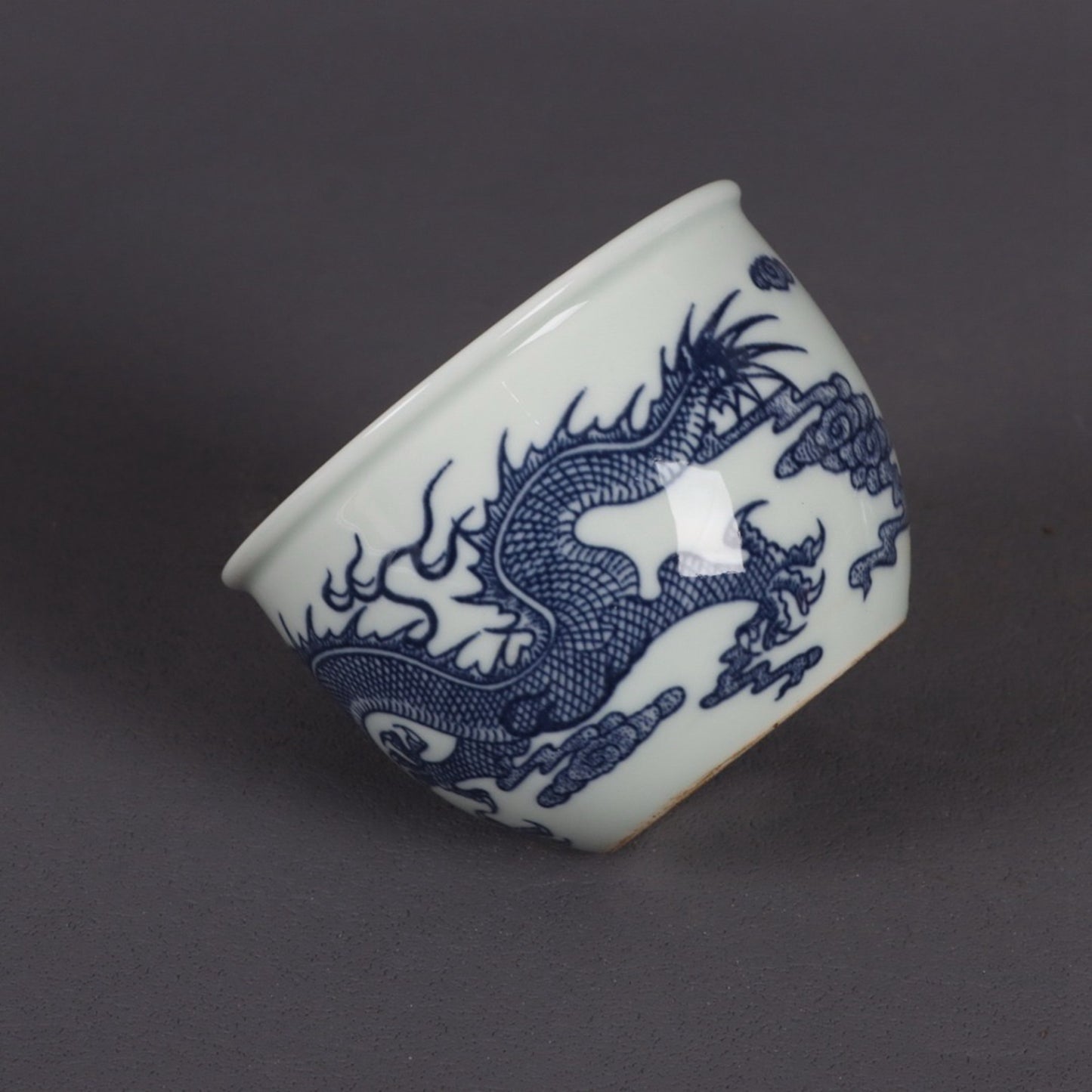 A pair of blue and white dragon patterned cups