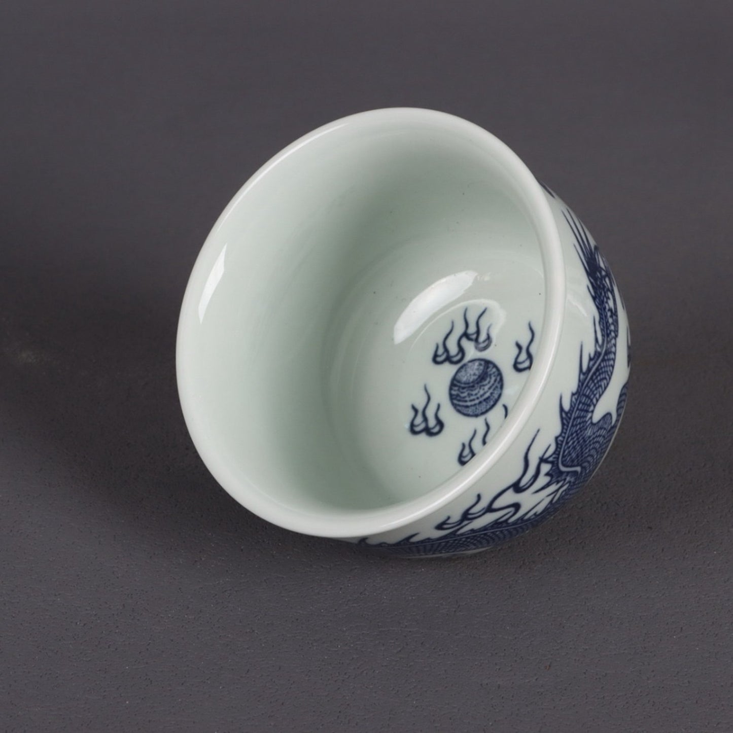 A pair of blue and white dragon patterned cups