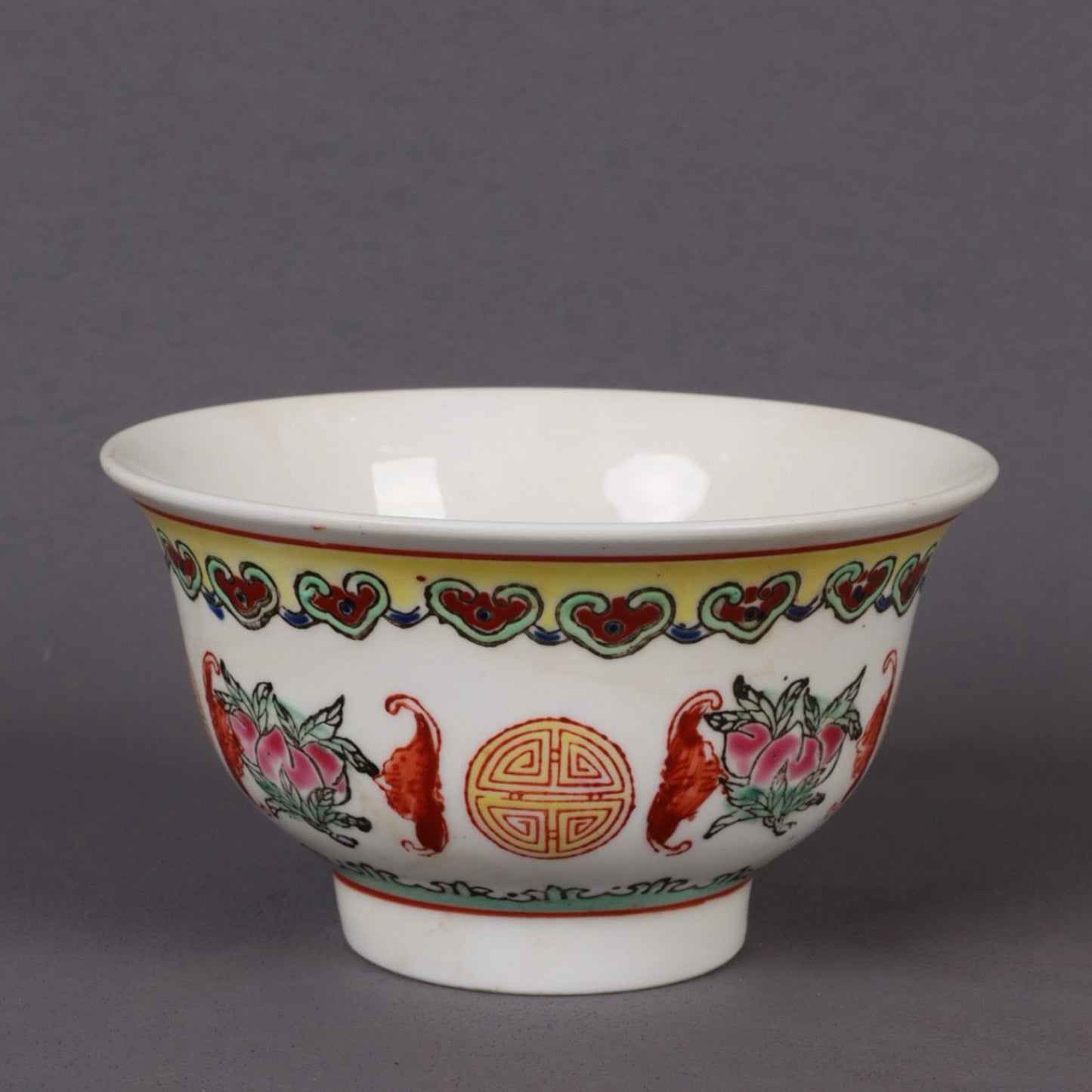 A pair of pink longevity patterned bowls