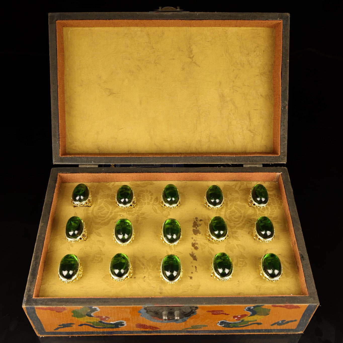 A box of Chinese antique grandmother emerald rings