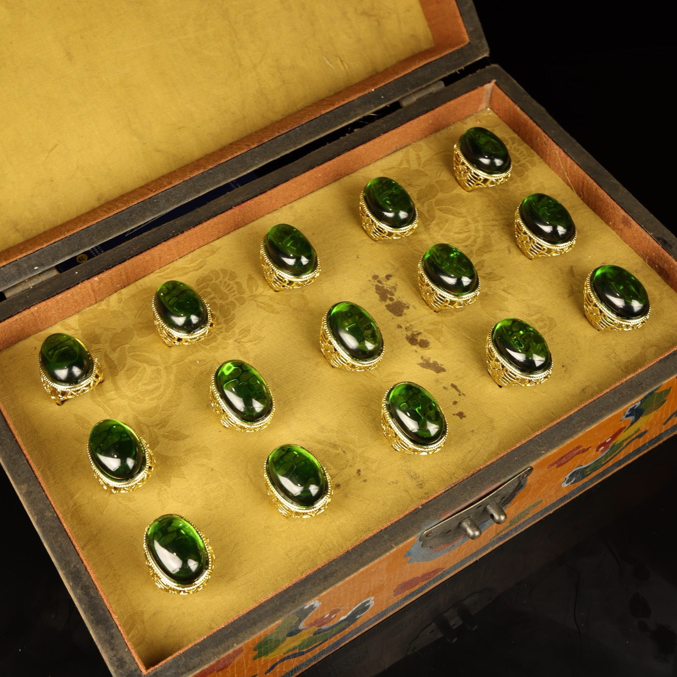 A box of Chinese antique grandmother emerald rings