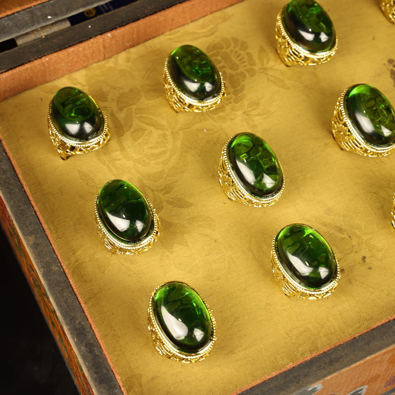 A box of Chinese antique grandmother emerald rings