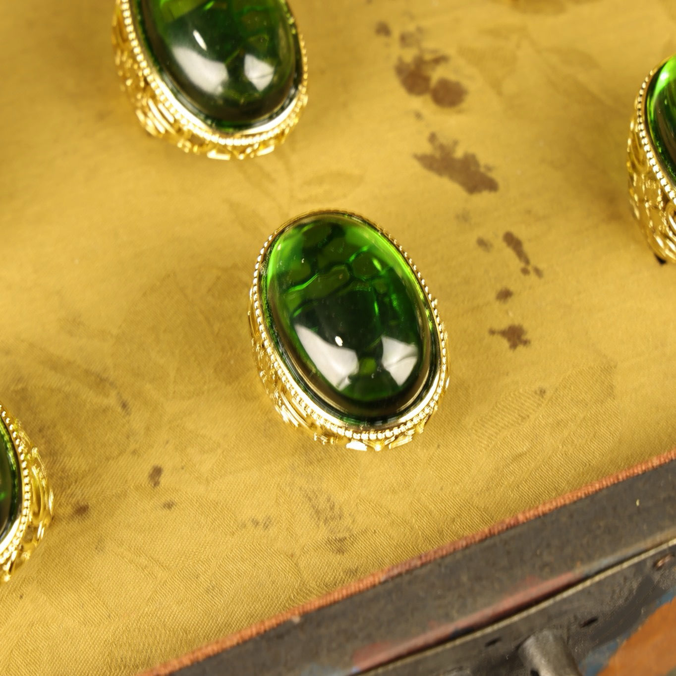 A box of Chinese antique grandmother emerald rings