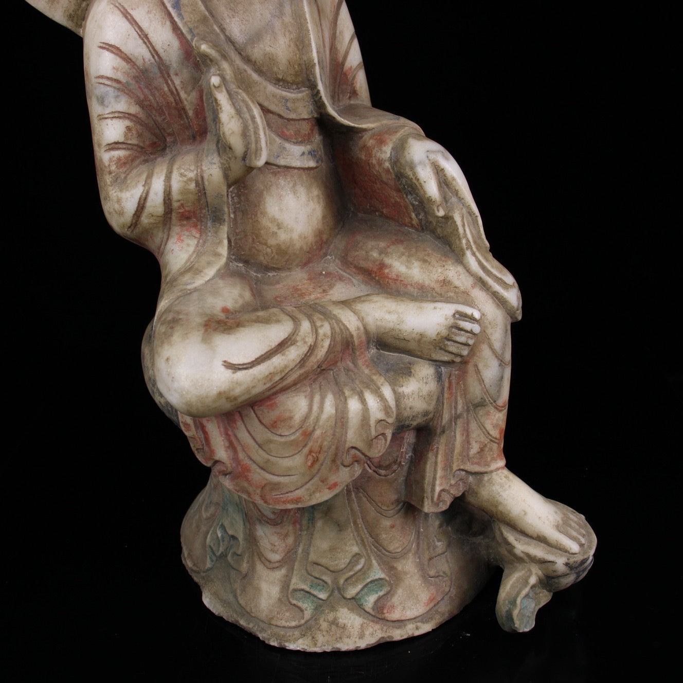 A sitting Buddha statue carved and painted on Chinese antique jade during the Northern Qi Dynasty