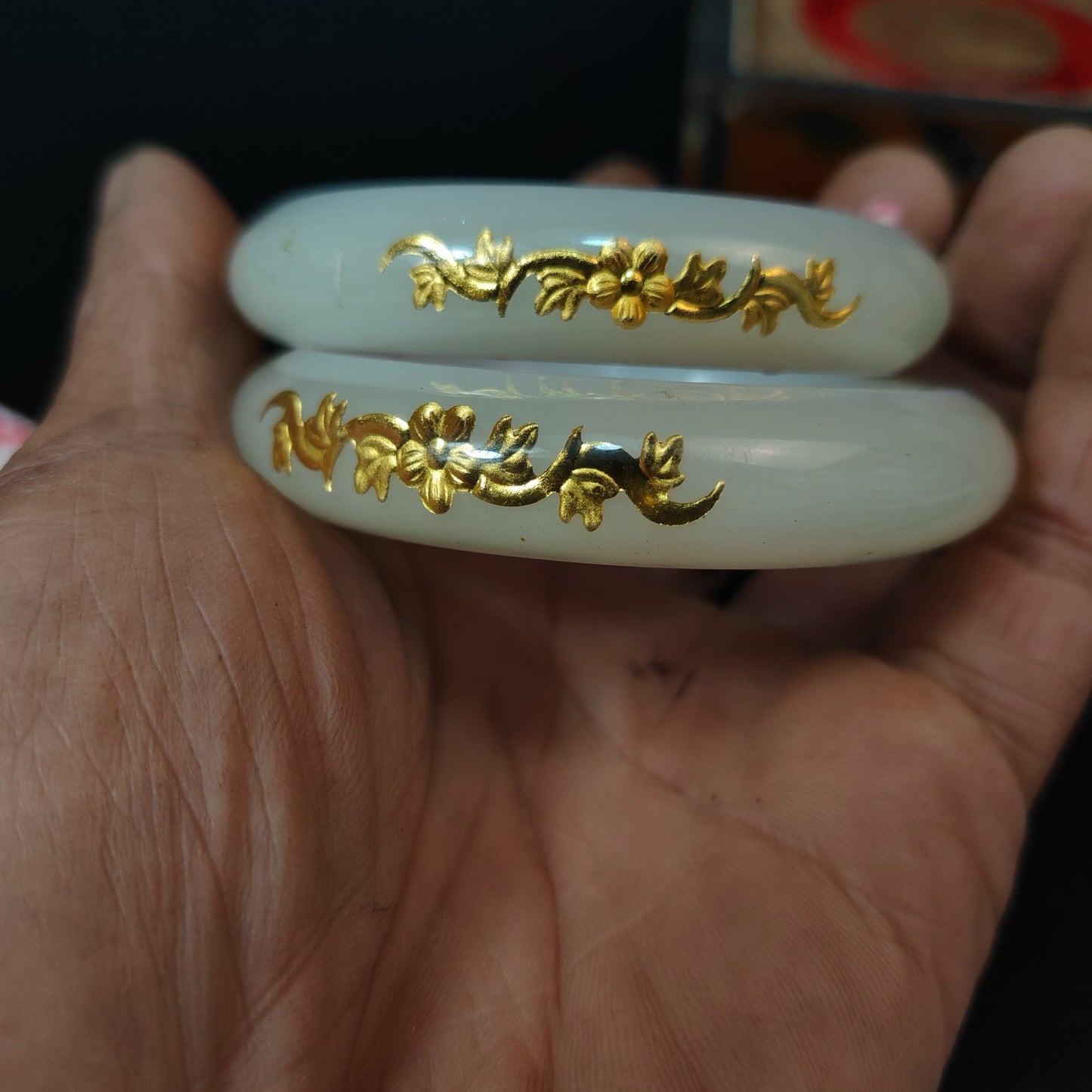 A box of Chinese antique white jade inner carved bracelets