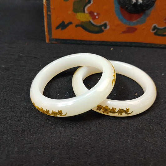 A box of Chinese antique white jade inner carved bracelets