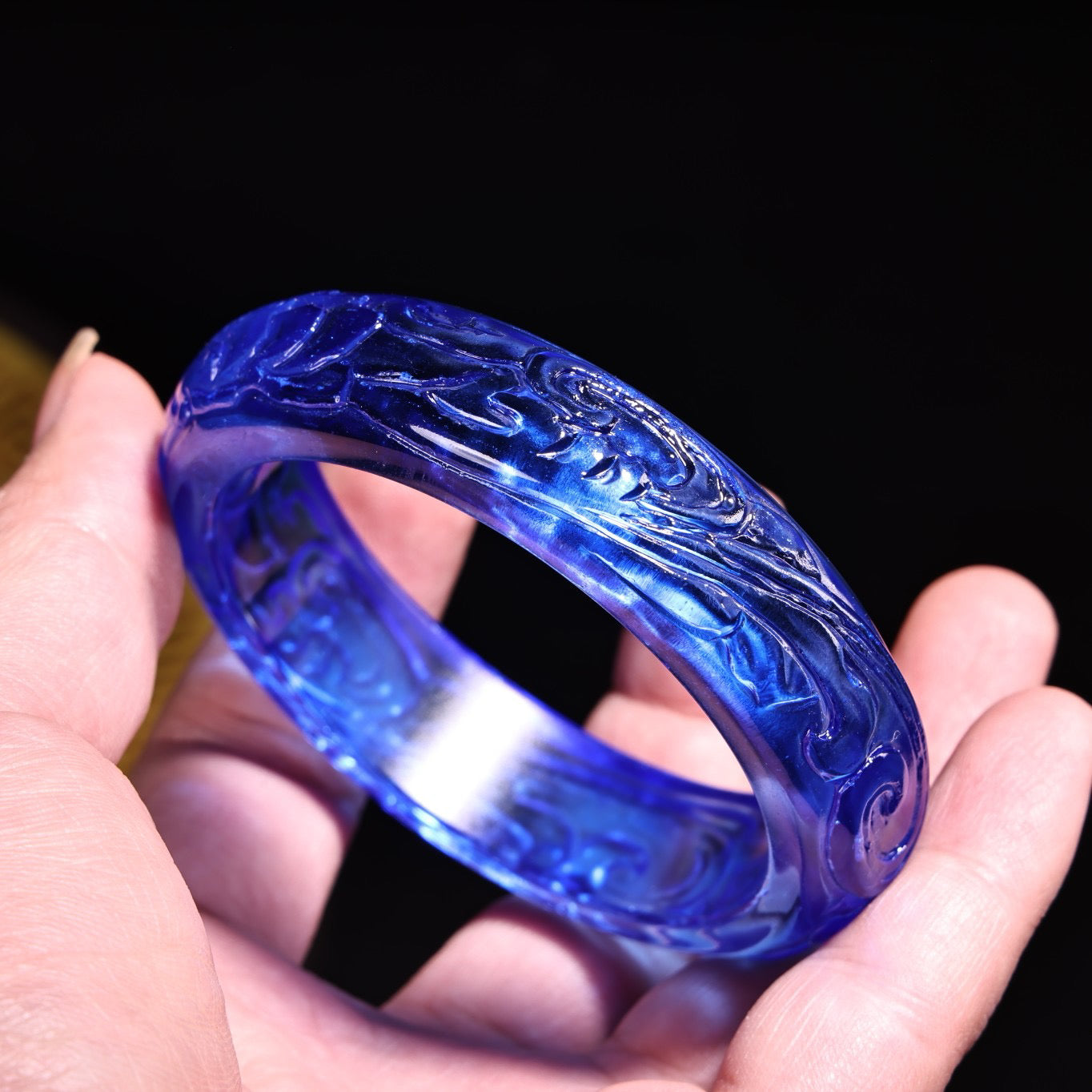 A box of Chinese antique bracelets, rings, and jewelry