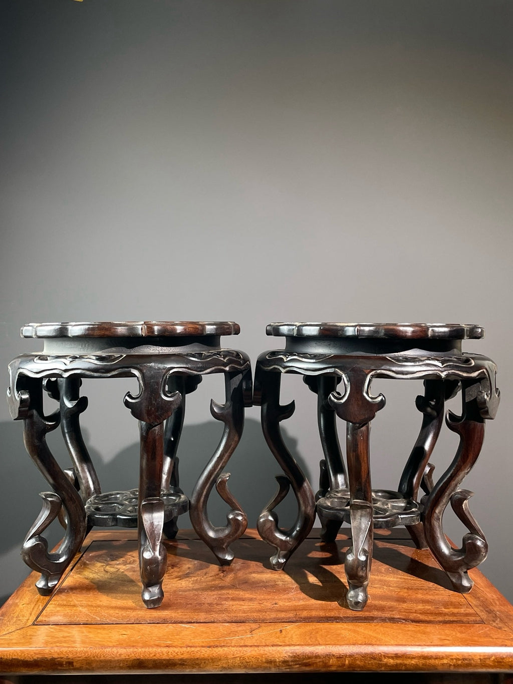 A pair of sandalwood windhead flower rack ornaments