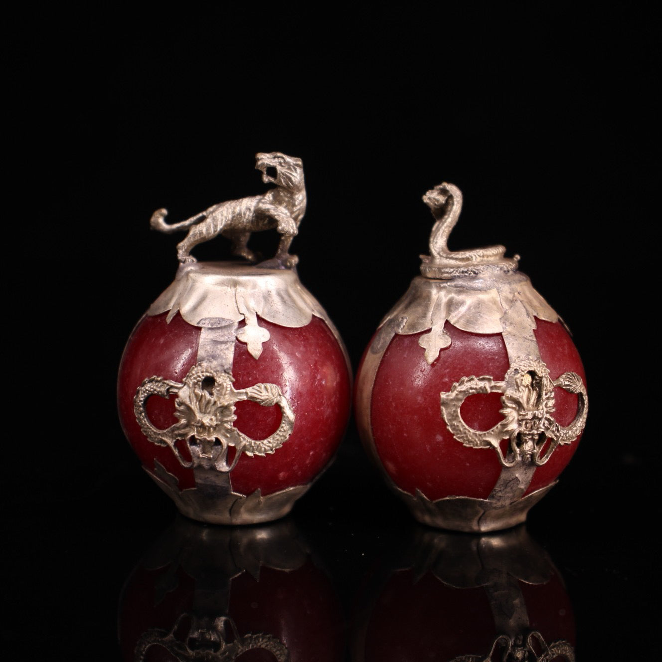 A set of Chinese antique silver wrapped jade zodiac balls