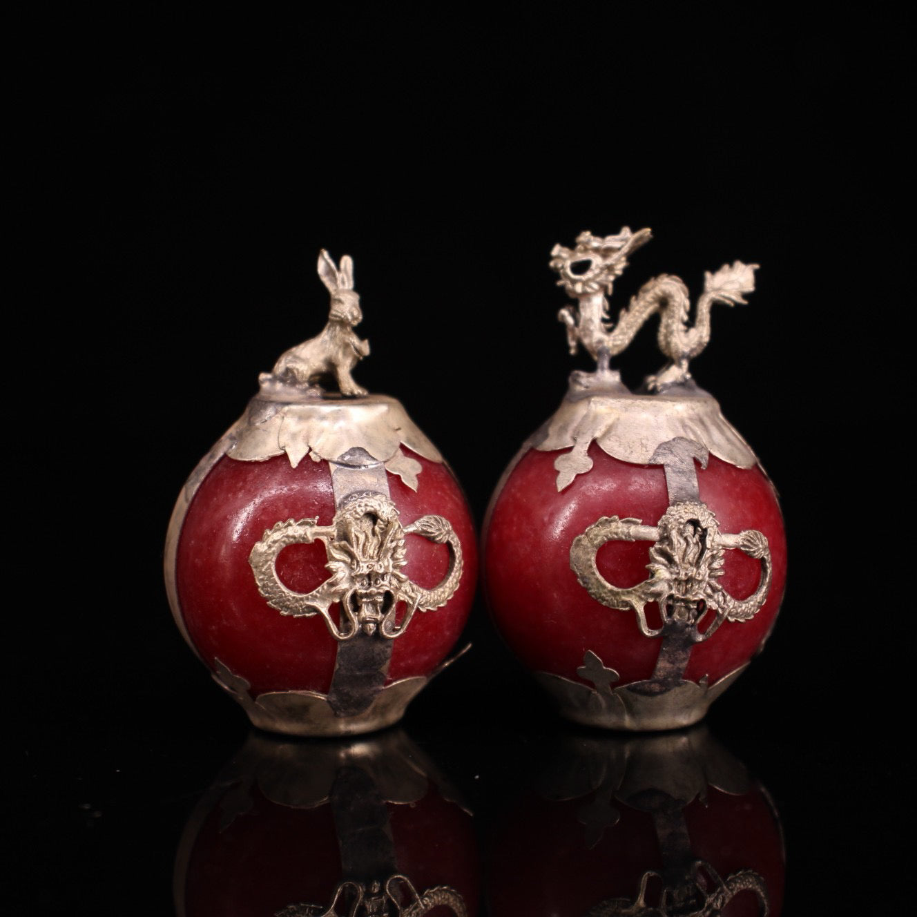 A set of Chinese antique silver wrapped jade zodiac balls