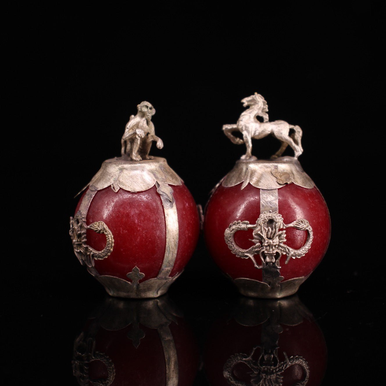 A set of Chinese antique silver wrapped jade zodiac balls