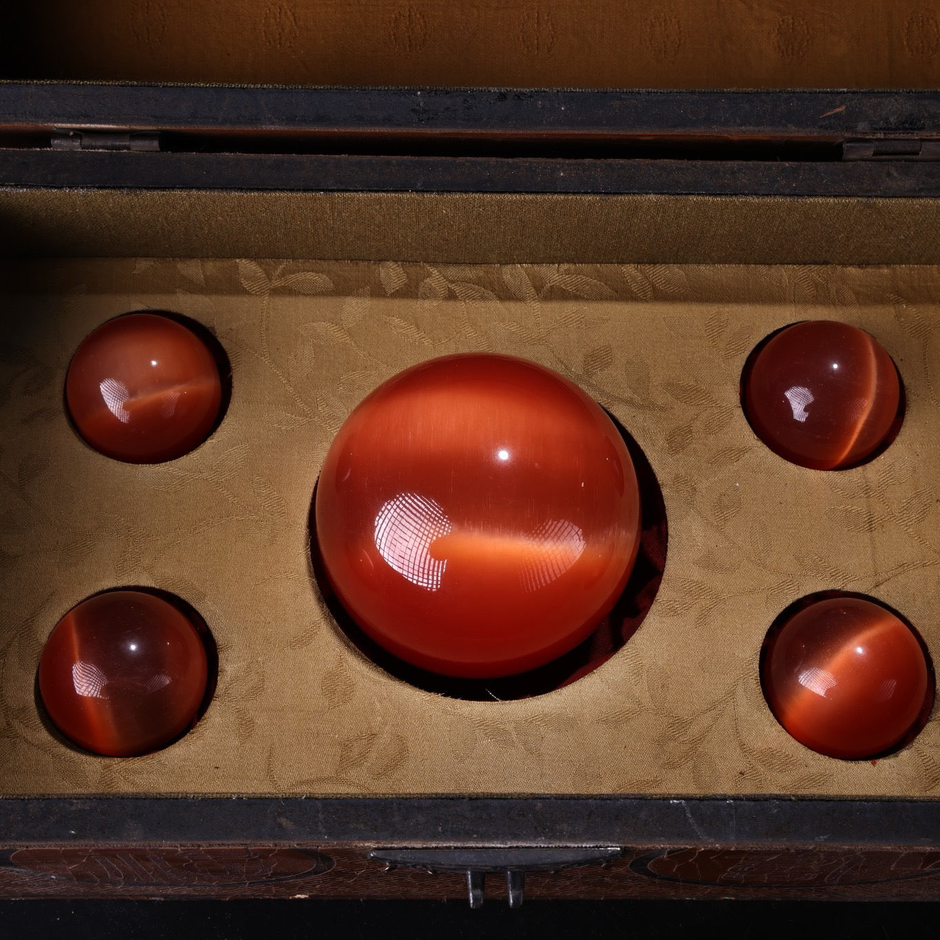 A box of Chinese antique cat's eye stone balls