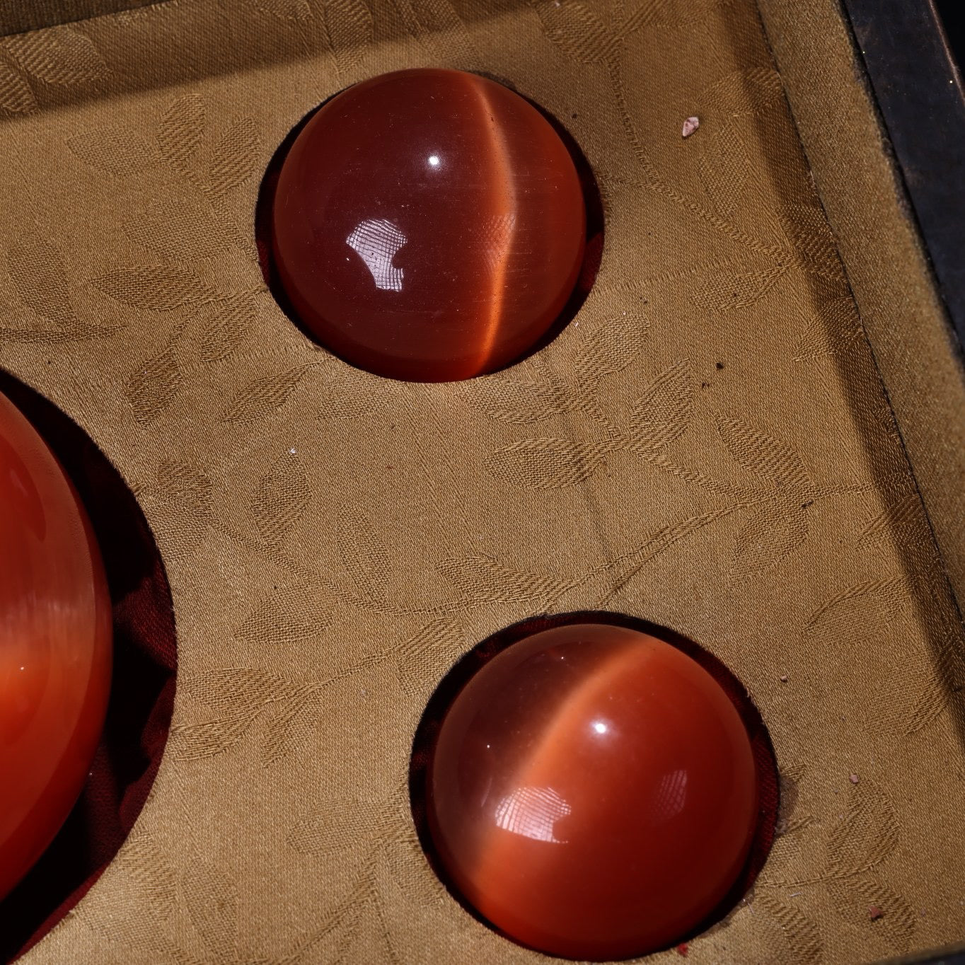 A box of Chinese antique cat's eye stone balls