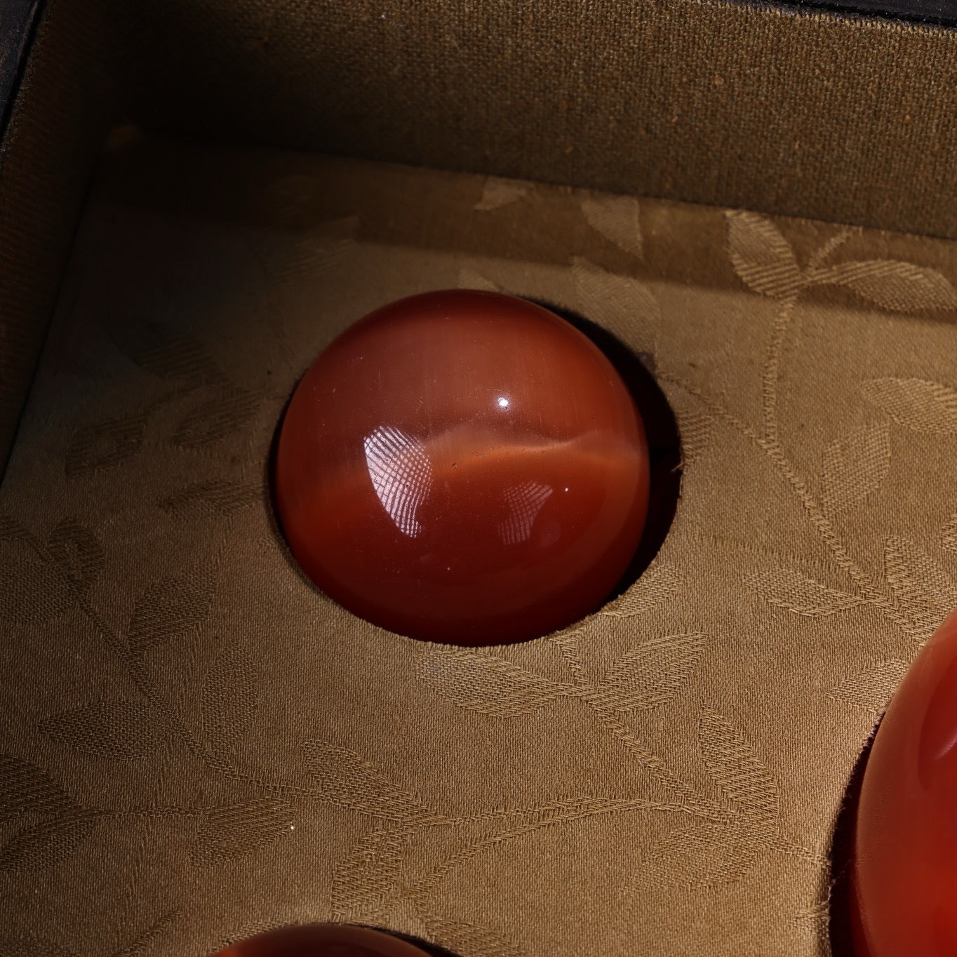 A box of Chinese antique cat's eye stone balls