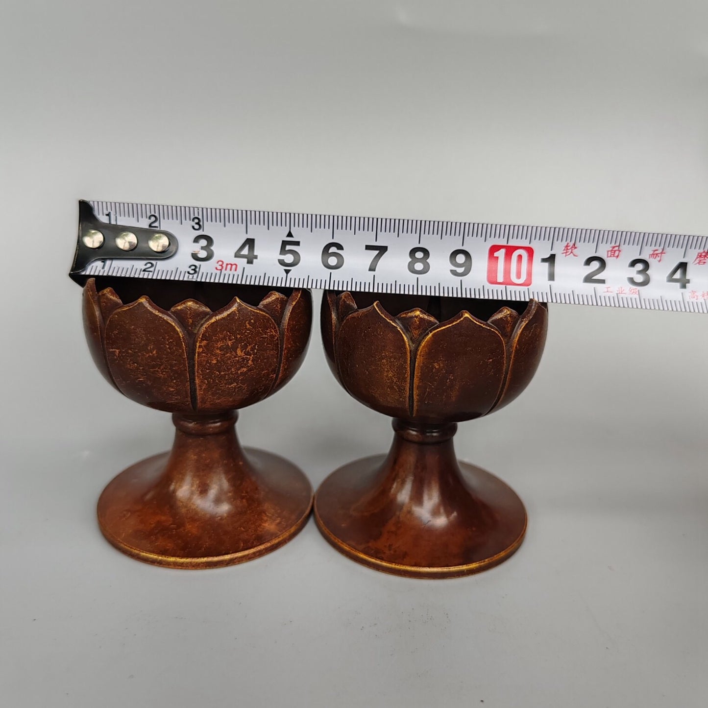 A pair of Chinese antique pure copper small lotus flower figurines