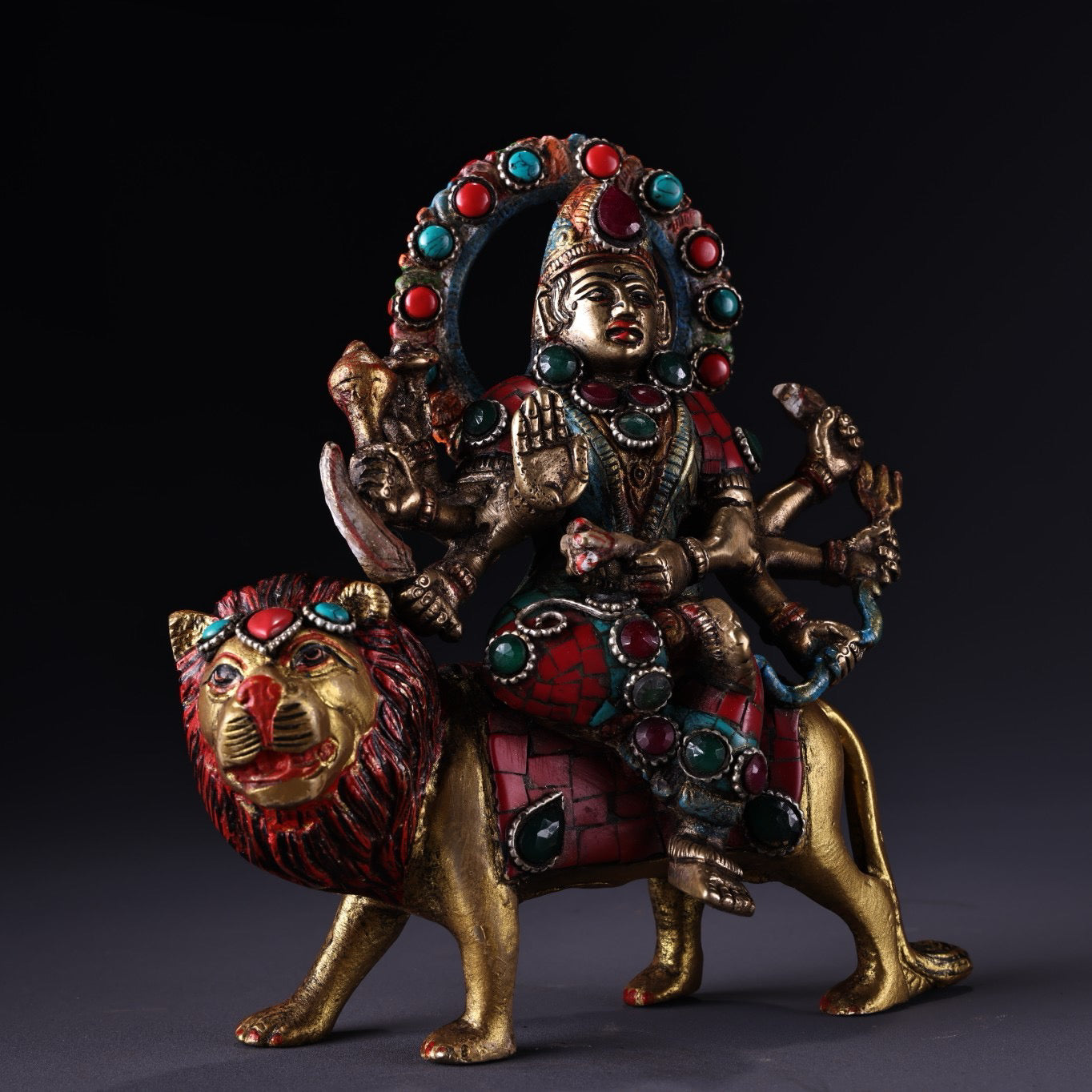 Chinese antique pure copper six armed lion riding guardian deity