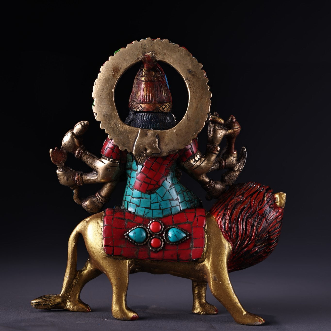 Chinese antique pure copper six armed lion riding guardian deity