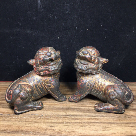 A pair of antique Chinese bronze lions