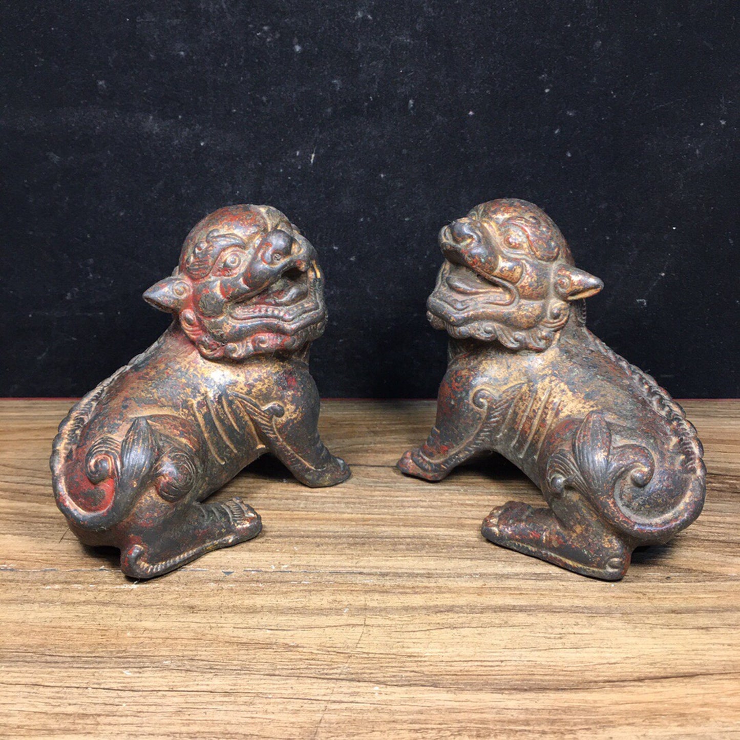 A pair of antique Chinese bronze lions