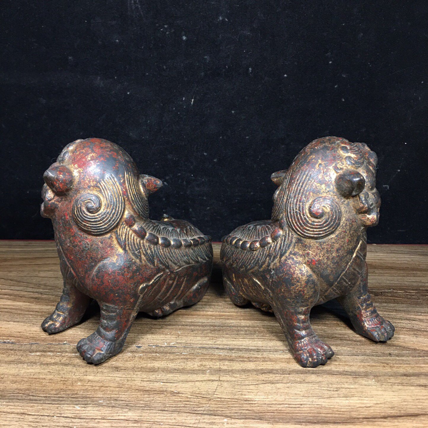 A pair of antique Chinese bronze lions